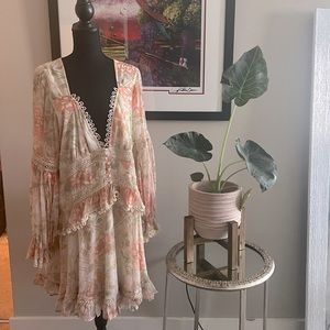 Flirty Garden Style Dress. Great movement, open back.